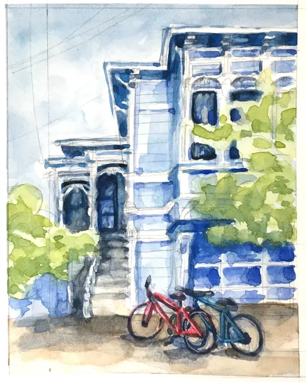 Watercolor house portrait of a beloved blue Victorian house in San Francisco. The house has arched windows, is surrounded by greenery, and has two bicycles in the foreground.