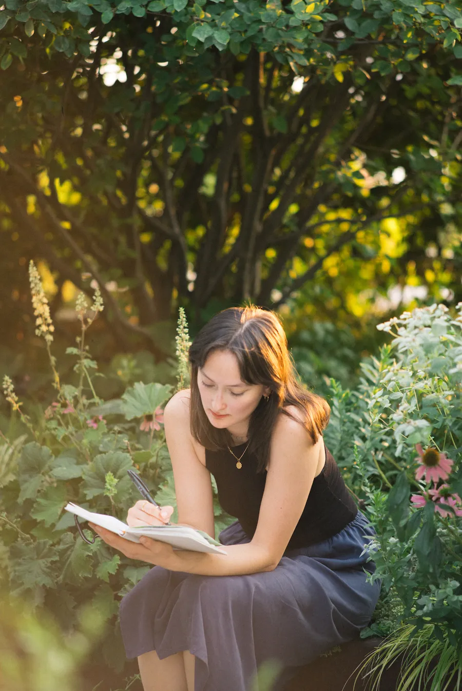 Natalie sketching outdoors in a garden